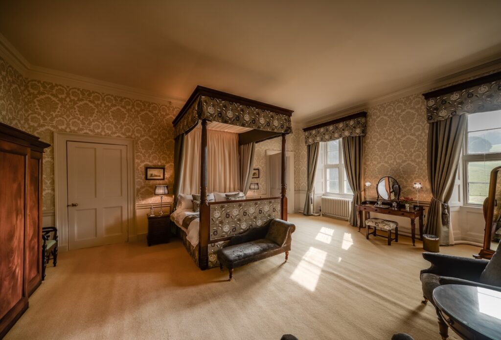 Elegant bedroom with four-poster bed.
