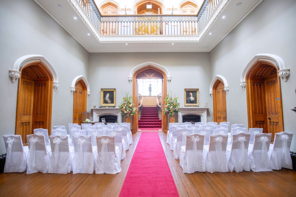 Elegant wedding venue with decorated chairs