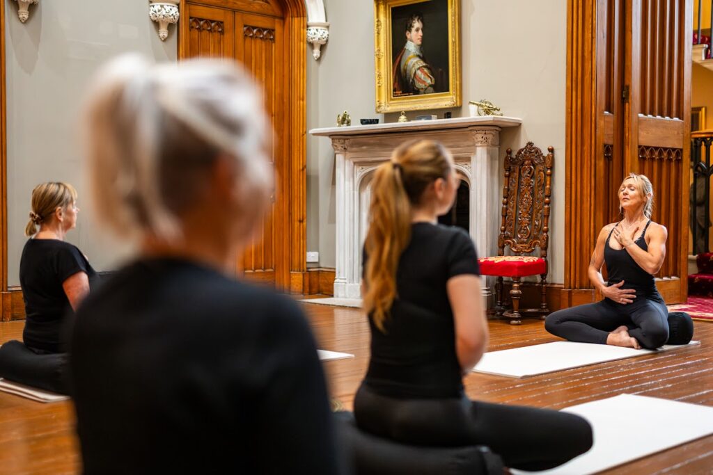 Yoga session in elegant interior setting.