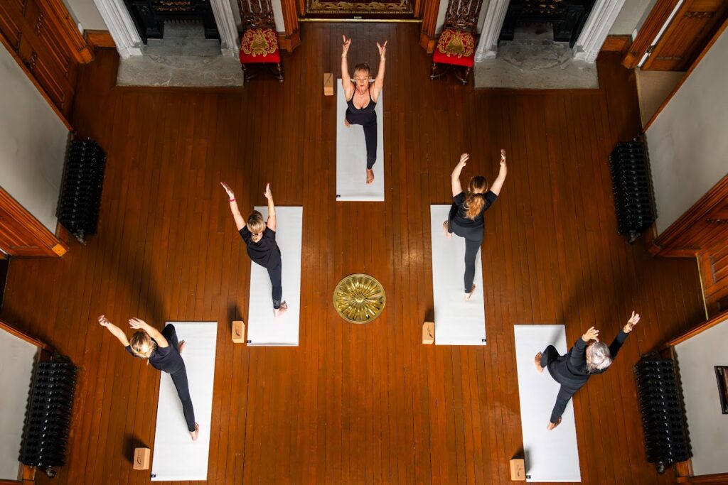 Yoga session in elegant interior setting.